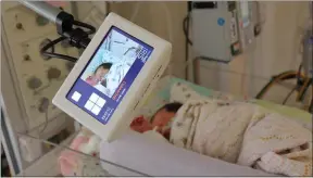  ?? SUBMITTED PHOTO ?? An AngelEye Camera looks over baby Jolene in the Chester County Hospital NICU, simultaneo­usly showing on her family’s phones.