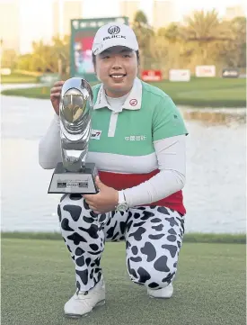  ??  ?? Feng Shanshan of China with the winner’s trophy.