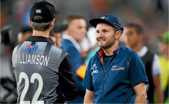  ?? ANDREW CORNAGA/PHOTOSPORT ?? Mike Hesson and Kane Williamson were powerless to stop Australia last Friday.