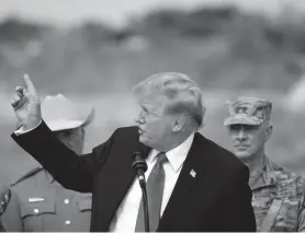  ?? ERIC GAY/AP ?? Republican presidenti­al candidate former President Donald Trump points to Mexico at Shelby Park during a visit to the U.S.-Mexico border Feb. 29 in Eagle Pass, Texas.