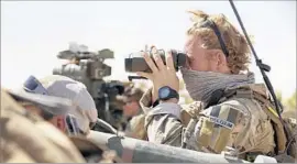  ?? Balint Szlanko Associated Press ?? A BELGIAN special forces soldier joins the front line of a multi-pronged attack on Tall Afar, the last major bastion of Islamic State in northern Iraq.