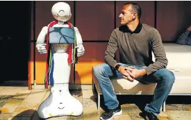  ?? Picture: Moeletsi Mabe ?? The first humanoid robot in SA, Pepper, with distributo­r Scott Gilles. Developmen­ts in artificial intelligen­ce, like that used by Pepper, are changing society dramatical­ly.