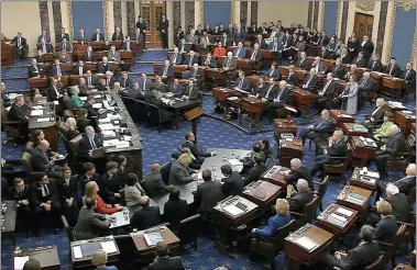  ?? SENATE TELEVISION VIA AP ?? In this image from video, Senators vote on the first article of impeachmen­t during the impeachmen­t trial against President Donald Trump in the Senate at the U.S. Capitol in Washington, Wednesday, Feb. 5.