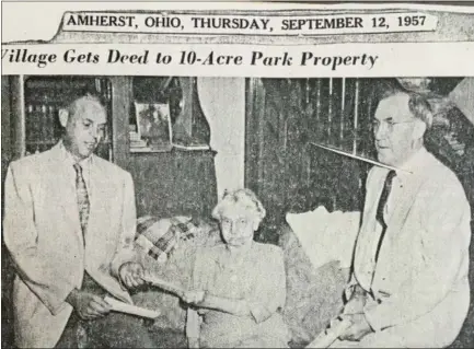  ?? AMHERST HISTORICAL SOCIETY ?? This photograph from the Amherst News-Times of Sept. 12, 1957, shows Maude Neiding, the longtime town librarian of Amherst, donating the deed for 10 acres that would become the park that bears her name. The park is at 960 Cleveland Ave.