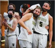  ?? JAMES BEAVER/FOR MEDIANEWS GROUP ?? Wood’s Ryanne Allen (5) congratula­tes Kaitlyn Orihel (4) after Orihel became Archbishop Wood’s leading scorer of all time during their PIAA 4A quarter final game against Gwynedd Mercy Saturday afternoon.