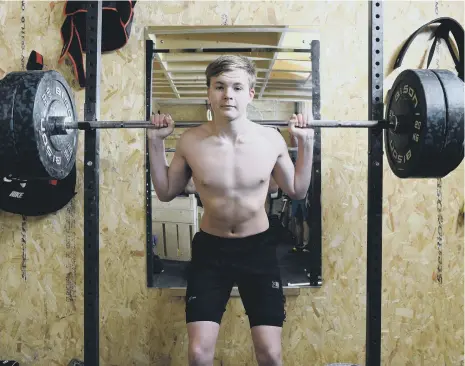  ??  ?? Young weightlift­er Josh Bland has been training since he was 11.