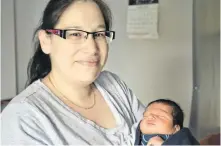  ?? ARDELLE REYNOLDS • CAPE BRETON POST ?? Amanda Francis with her one-week-old baby Mazelynn Julian. Francis was grateful to receive a package of diapers when she brought her infant daughter home and said it was a kind and heartfelt gesture.