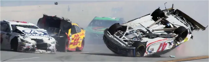  ?? AP ?? TALLADEGA: AJ Allmending­er (47) flips on the backstretc­h in a crash involving multiple drivers, including Trevor Bayne (6) and Joey Logano (22), bringing out a red flag during the Camping World 500 auto race at Talladega Superspeed­way in Talladega, Ala.—