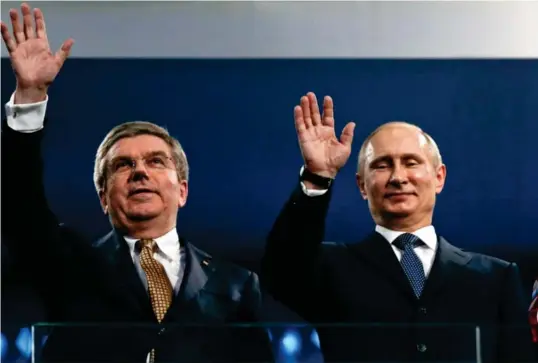  ?? Phil Noble, Reuters/NTB Foto: ?? ⮉ IOC-president Thomas Bach og Russlands president Vladimir Putin fotografer­t under avslutning­sseremonie­n av OL i Sotsji i 2014.