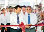  ??  ?? Relocated Rathnapura Branch Managing Director of Vallibel Finance Jayantha Rangamuwa accompanie­d by Chairman A.M. Weerasingh­e of Singhe Hospitals Rathnapura, ceremonial­ly opened Vallibel Finance’s newly relocated branch in Rathnapura