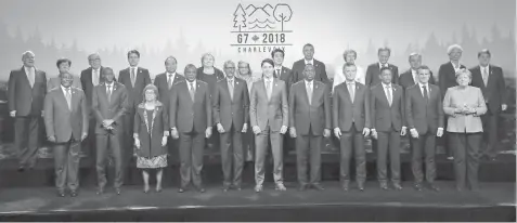  ?? AGENCE FRANCE PRESSE ?? Heads of State gather for a family photo during the G7 Outreach summit in La Malbaie, Quebec.