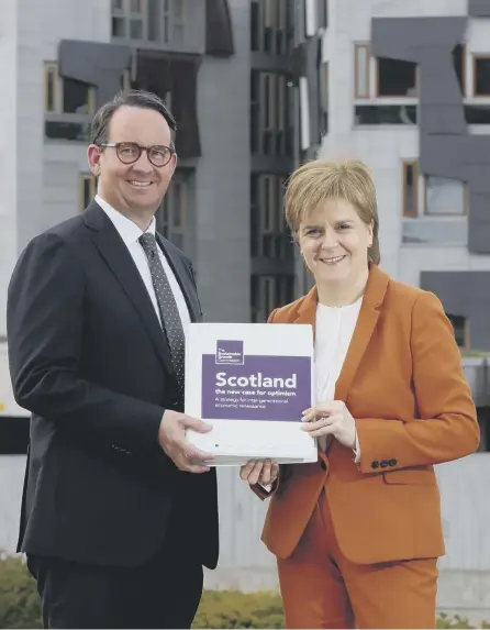  ??  ?? 2 Last gasp? First Minister Nicola Sturgeon receives the Sustainabl­e Growth Commission report from commission chair Andrew Wilson
