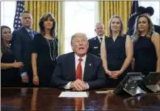  ?? CAROLYN KASTER — THE ASSOCIATED PRESS ?? President Donald Trump meets with crew and passengers of Southwest Airlines Flight 1380, including pilot Tammie Jo Shults, third from left, in the Oval Office of the White House in Washington, Tuesday.