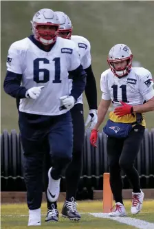  ?? NAncy LAnE / HErALd STAFF FILE ?? DECISION TO MAKE: Marcus Cannon, left, must decide whether he wants to return to the Patriots or choose retirement after opting out of the 2020 season.