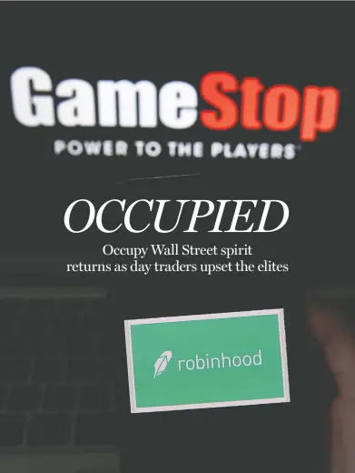  ?? OLIVIER DOULIERY/AFP VIA GETTY IMAGES ?? An epic battle is unfolding on Wall Street, with a cast of characters clashing over the fate of GameStop, a struggling chain of video game retail stores. The conflict has sent GameStop on a stomach-churning ride with amateur investors
taking on the financial establishm­ent in the mindset of the Occupy Wall Street movement started a decade ago.