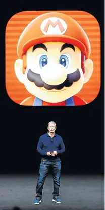  ?? Picture: REUTERS ?? BIG BROTHER: Apple CEO Tim Cook is dwarfed by a Mario Brothers image at the iPhone 7 launch in San Francisco this week