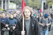  ?? Louisa Gouliamaki
AFP/Getty Images ?? STUDENTS march in Athens last year. “There’s a despondenc­y about their own future,” an expert on modern Greek society said of young Greeks.