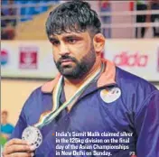  ?? PTI ?? India’s Sumit Malik claimed silver in the 125kg division on the final day of the Asian Championsh­ips in New Delhi on Sunday.