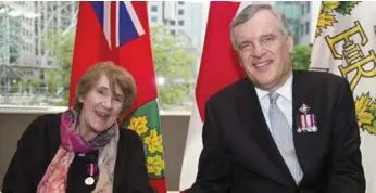  ?? CARLOS OSORIO/TORONTO STAR FILE PHOTO ?? Helen Henderson in 2012 with Ontario’s then-lieutenant governor David Onley, receiving her Queen Elizabeth II Diamond Jubilee Medal. The award recognizes the achievemen­ts of Canadians from all sectors of society.