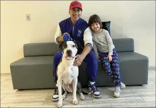  ?? FAIRFAX COUNTY (VA.) ANIMAL SHELTER ?? Alan Moncayo and his 5-year-old daughter Sabrina welcomed to their home Jihoo, who had been in a Virginia animal shelter for 240 days before their chance meeting.