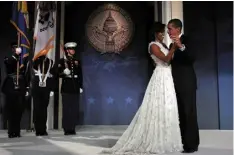  ??  ?? Michelle Obama, far left, speaking in 2012 and, left, with husband Barack after his 2009 inaugurati­on