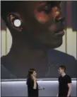  ??  ?? Google’s Isabelle Olsson, left, and Juston Payne give a demonstrat­ion of translatin­g languages through Google Pixel Buds at a Google event at the SFJAZZ Center in San Francisco.