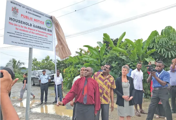  ?? Photo: ?? Tui Tacirua Setareki Raibevu unveils the waste disposal and collection signage with the Minister for Local Government, Housing, Environmen­t, Infrastruc­ture and Transport Parveen Bala (middle) and Assistant Minister for Local Government, Housing,...