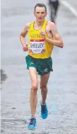  ??  ?? Michael Shelley wins the 2014 Games marathon.