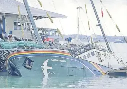  ?? Picture: John Miller/SUPPLIED ?? Bombed Rainbow Warrior at Marsden Wharf, Auckland, July 1985.