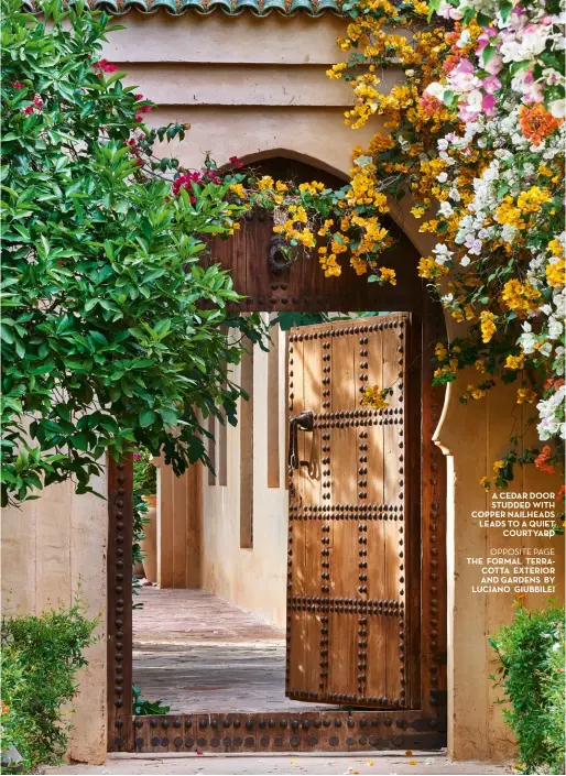  ??  ?? A cedar door studded with copper nailheads leads to A quiet courtyard
Opposite page the formal terracotta exterior And gardens by luciano giubbilei