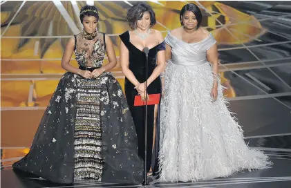  ?? CHRIS PIZZELLO / INVISION / THE ASSOCIATED PRESS ?? The stars of Hidden Figures, Janelle Monae, from left, Taraji P. Henson, and Octavia Spencer, present the award for best documentar­y feature.