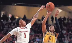  ??  ?? Southern Mississipp­i’s Gabe Watson, right, shoots over Texas Tech’s Terrence Shannon Jr. on Monday in Lubbock, Texas.