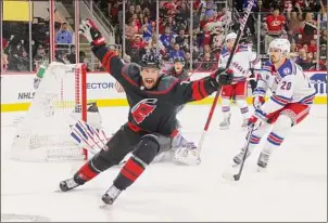  ?? Bruce Bennett / Getty Images ?? Brendan Smith of the Hurricanes scores a short-handed goal at 15:54 of the second period against the Rangers in Game 2 of the second round of the 2022 Stanley Cup Playoffs at PNC Arena on Friday night in Raleigh, N.C.