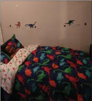  ?? SUBMITTED PHOTO ?? The donation of dinosaur bedding is carried out on the wall and generates smiles.