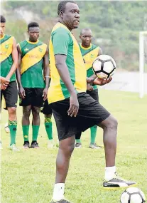  ?? FILE ?? Head coach Theodore Whitmore (foreground) during a Reggae Boyz training session.