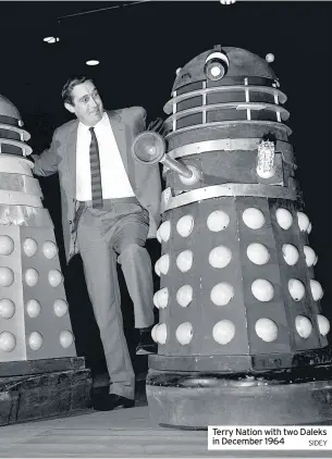  ?? SIDEY ?? Terry Nation with two Daleks in December 1964
