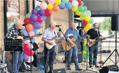  ??  ?? Great effort Musicians and store staff, pictured here, helped raise more than £1500 for Strathcarr­on Hospice