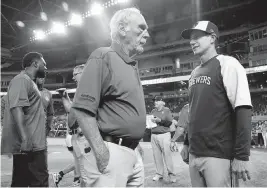  ?? LYNNE SLADKY AP ?? Jim Leyland, the manager of the 1997 Marlins, talks Saturday night with Brewers manager Craig Counsell, who scored the winning run in the 1997 World Series.