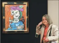  ?? JEWEL SAMAD / AFP ?? Pablo Picasso’s 1939 depiction of his mistress in Femme Assise, Robe Bleue (Seated Woman in Blue Dress) stands on display during Christie’s modern art sale in New York.