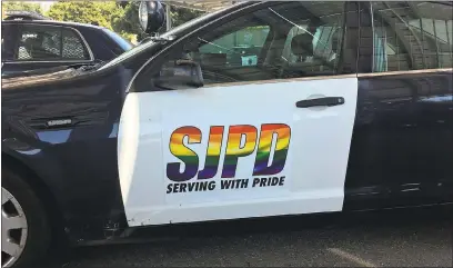  ??  ?? Above: A San Jose Police Department patrol vehicle outfitted with decals in honor of Silicon Valley Pride weekend. The department is launching a series of initiative­s to embrace and recruit the LGBT community.