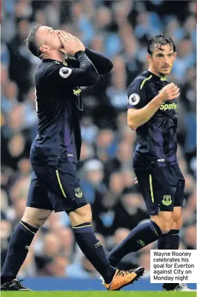  ??  ?? Wayne Rooney celebrates his goal for Everton against City on Monday night