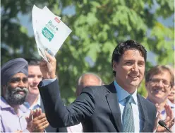  ?? DARRYL DYCK THE CANADIAN PRESS FILE PHOTO ?? Liberal Leader Justin Trudeau unveils his environmen­tal platform in 2015. If sunny ways won the day in the last vote, the forecast is decidedly more mixed this time.