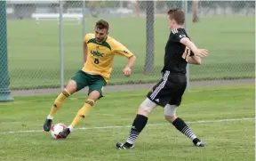  ?? CITIZEN FILE PHOTO ?? Francesco Bartolillo of the UNBC Timberwolv­es, left, shows some fancy footwork during a 2017 Canada West game.