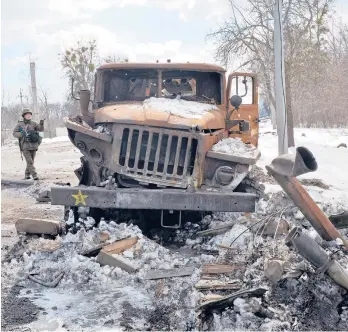  ?? SERGEY BOBOK/GETYY-AFP ?? A destroyed Russian rocket launcher on the side of a road Wednesday outside Kharkiv, Ukraine.