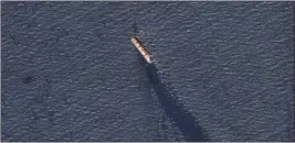  ?? PLANET LABS PBC — FOR THE ASSOCIATED PRESS ?? In this satellite image Tuesday, the Belize-flagged bulk carrier Rubymar is seen in the southern Red Sea near the Bay el-Mandeb Strait leaking oil after an attack.