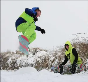  ?? Snowboarde­rs Jason Stack and Eoin O’Mahony enjoying the opportunit­y to hit the snow at Stacks Mountains on Friday. Photo by Domnick Walsh ??