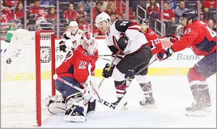  ??  ?? Christian Fischer #36 of the Arizona Coyotes scores a goal on goalie Braden Holtby #70 of the Washington Capitals during the first period at Capital One
Arena on Nov 6, in Washington, DC. (AFP)