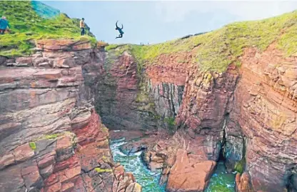  ??  ?? Lee Mitchell in action at Arbroath cliffs.