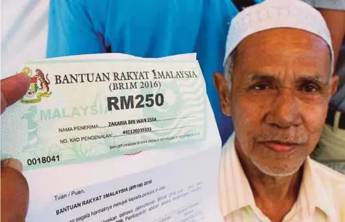  ??  ?? BANTUAN BR1M diperkenal­kan pada tahun 2012.