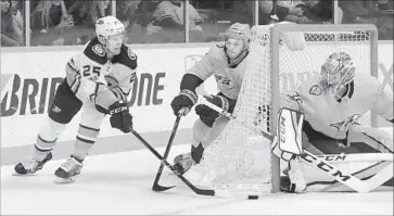  ?? Mark Humphrey Associated Press ?? ONDREJ KASE of the Ducks tries to score against Pekka Rinne of the Predators as Anthony Bitetto defends.